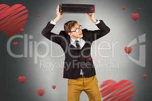 Composite image of young geeky businessman holding briefcase