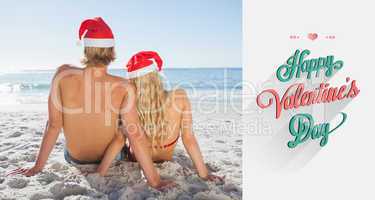 Composite image of rear view of couple sitting on beach