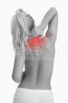 Rear view of topless woman with neck pain