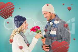 Composite image of attractive man in winter fashion offering ros