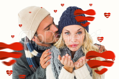 Composite image of attractive couple in winter fashion