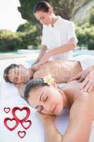 Composite image of attractive couple enjoying couples massage po