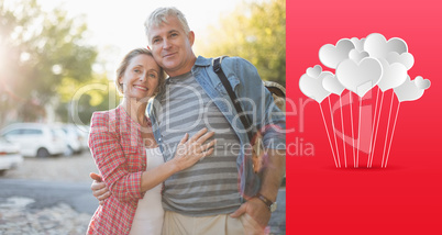 Composite image of happy mature couple hugging in the city