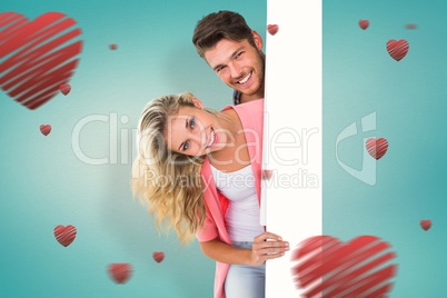 Composite image of attractive young couple smiling at camera