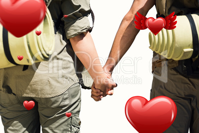 Composite image of hitch hiking couple standing holding hands on