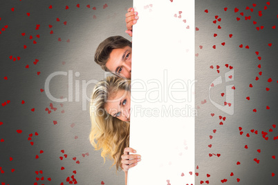 Composite image of attractive young couple smiling at camera