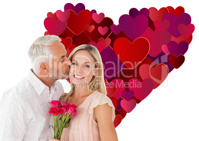 Composite image of affectionate man kissing his wife on the chee