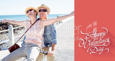 Composite image of happy casual couple going for a bike ride on