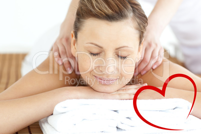 Composite image of relaxed woman enjoying a back massage