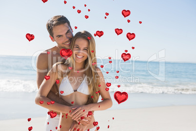 Composite image of athletic couple smiling at camera