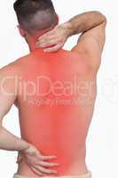 Rear view of shirtless man with neck pain over