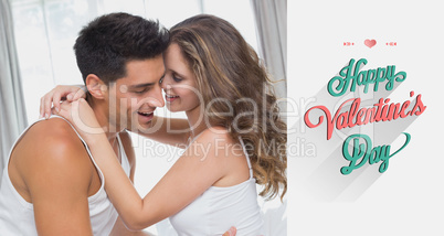 Composite image of couple sitting in bed at home Composite image of couple sitting in bed at home