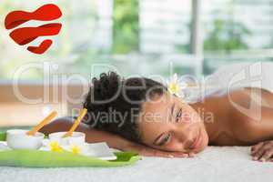 Composite image of gorgeous woman lying on massage table with sa