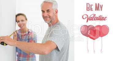 Composite image of happy couple making some measurements togethe