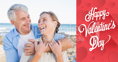 Composite image of happy casual couple by the coast