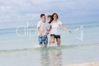 young happy couple in summer holiday vacation summertime