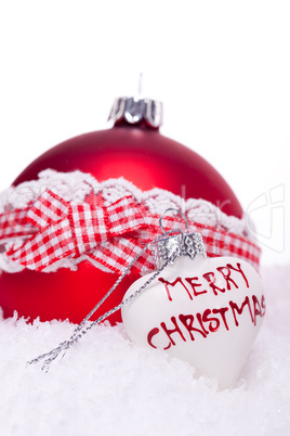 christmas decoration festive red bauble in snow isolated