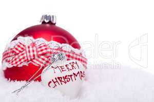 christmas decoration festive red bauble in snow isolated