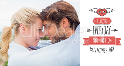 Composite image of cute affectionate couple standing outside wra