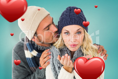 Composite image of attractive couple in winter fashion