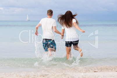 young happy couple in summer holiday vacation summertime