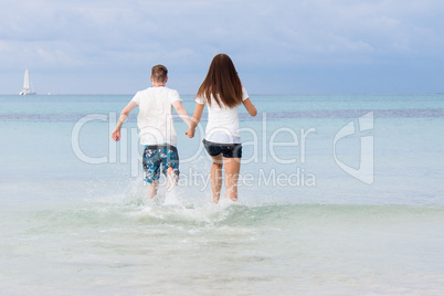 young happy couple in summer holiday vacation summertime