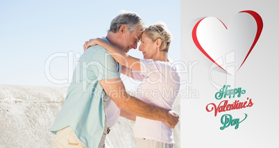 Composite image of happy senior couple embracing on the pier