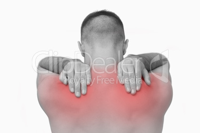 Rear view of shirtless man with shoulder pain