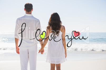 Composite image of attractive couple holding hands and watching