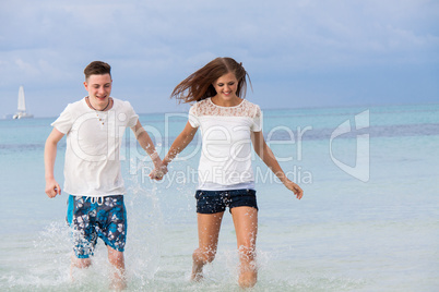 young happy couple in summer holiday vacation summertime