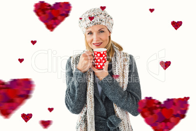 Composite image of smiling woman in winter fashion looking at ca Composite image of smiling woman in winter fashion looking at ca