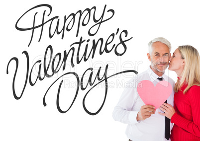 Composite image of handsome man holding paper heart getting a ki