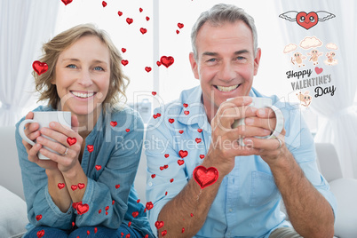 Composite image of smiling middle aged couple sitting on the cou