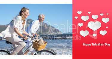 Composite image of smiling couple riding their bikes on the beac