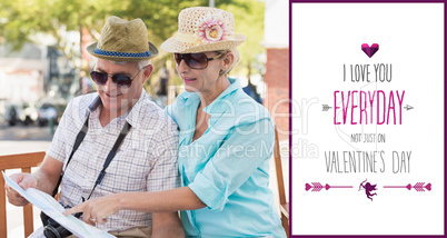 Composite image of happy tourist couple looking at map in the ci