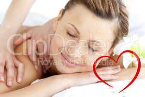 Composite image of young woman enjoying a back massage