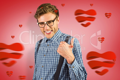 Composite image of geeky hipster showing thumbs up