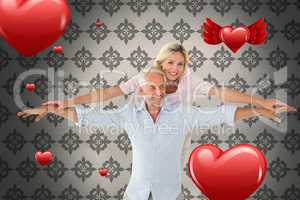 Composite image of smiling couple posing with arms out