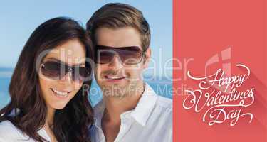 Composite image of smiling couple wearing sunglasses and looking