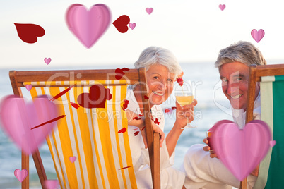 Composite image of senior couple drinking a cocktail