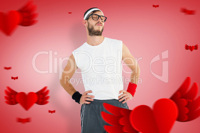 Composite image of geeky hipster posing in sportswear