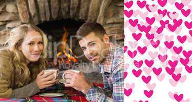 Composite image of couple with tea cups in front of lit fireplac