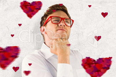 Composite image of young geeky businessman with hand on chin