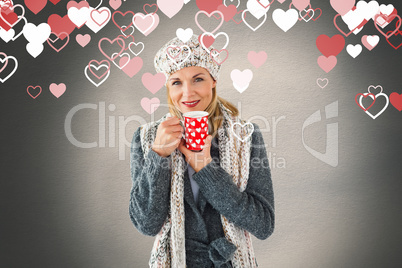 Composite image of smiling woman in winter fashion looking at ca