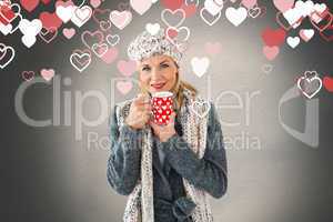 Composite image of smiling woman in winter fashion looking at ca