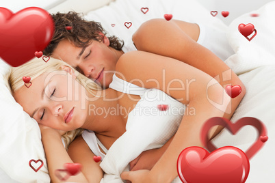 Composite image of quiet couple hugging while sleeping