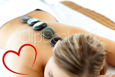 Composite image of confident woman having a massage