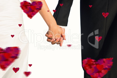 Composite image of close up of cute young newlyweds holding thei