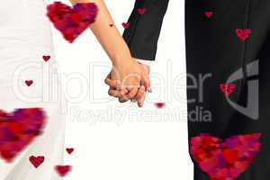 Composite image of close up of cute young newlyweds holding thei