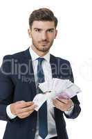 Wealthy successful businessman burning money